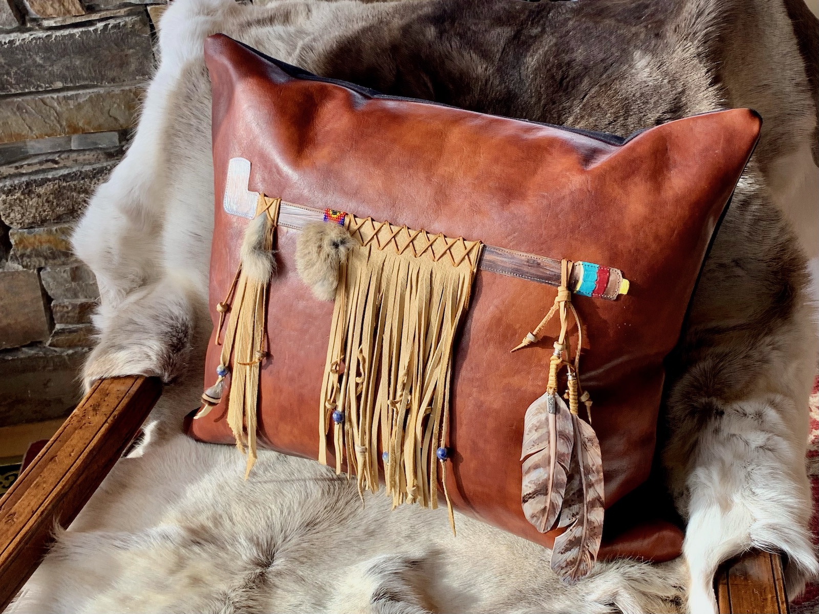 Leather Pillow with a peace pipe applique